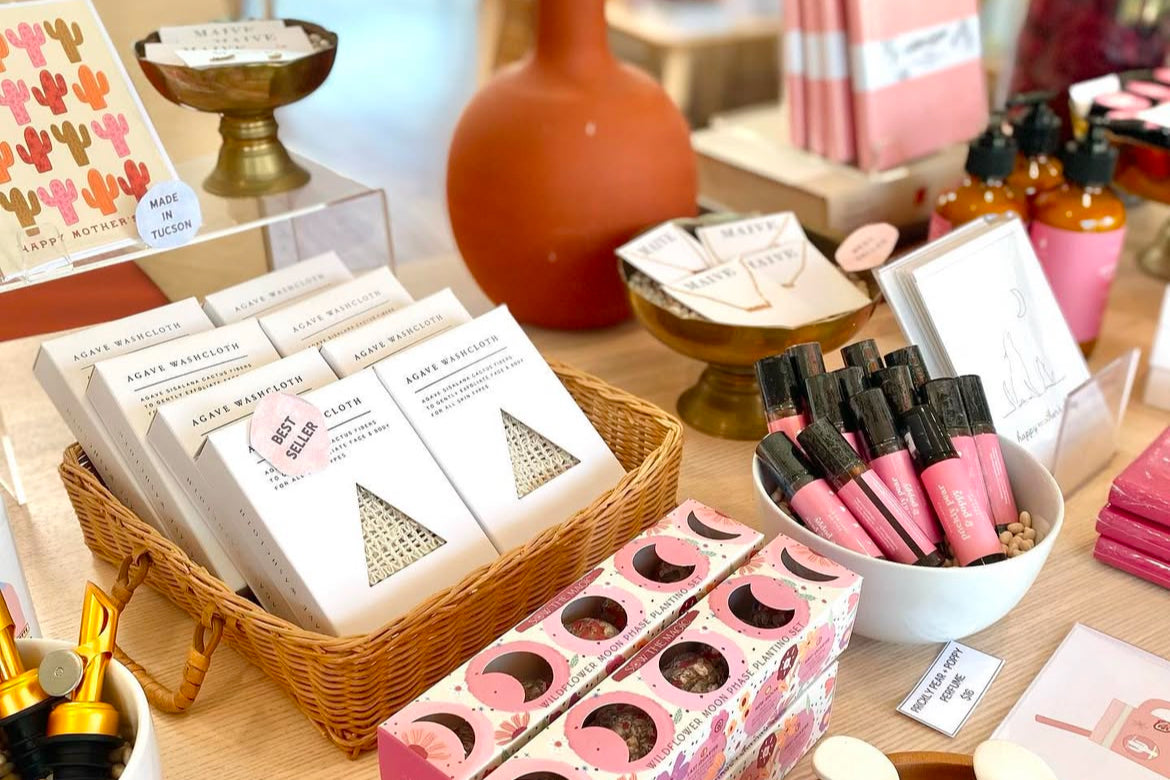 A pink color-story display of gifts and stationery at Creative Kind