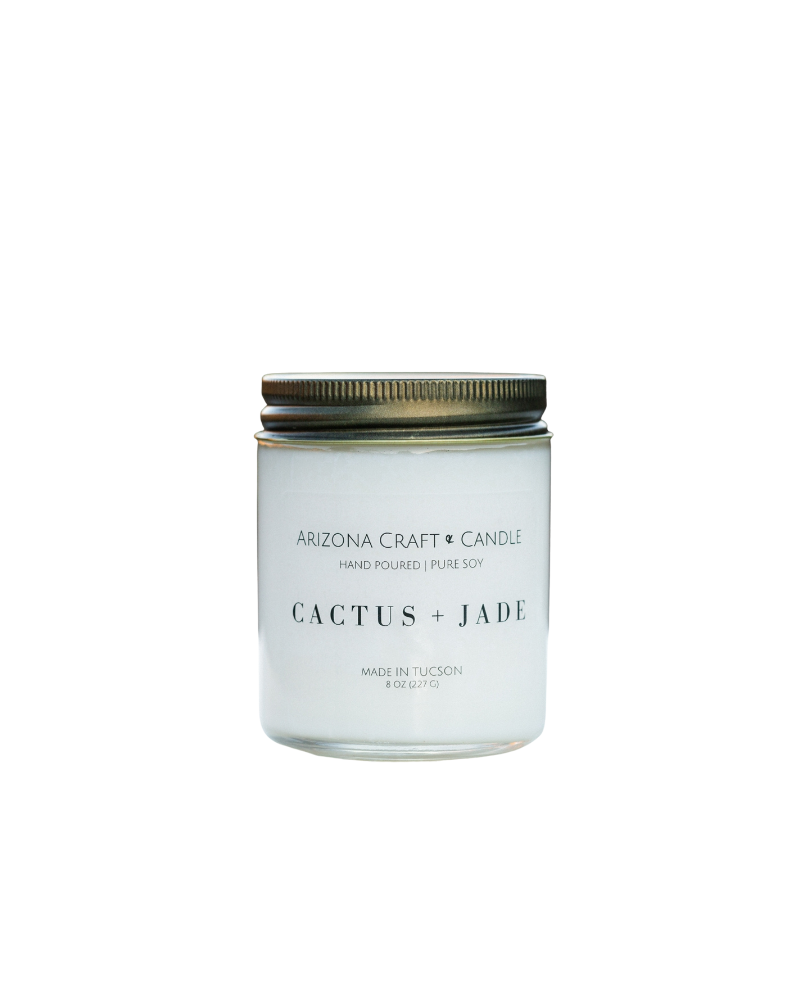 Clear glass jar candle with gold lid. Cactus and jade scent from Arizona Craft and Candle.