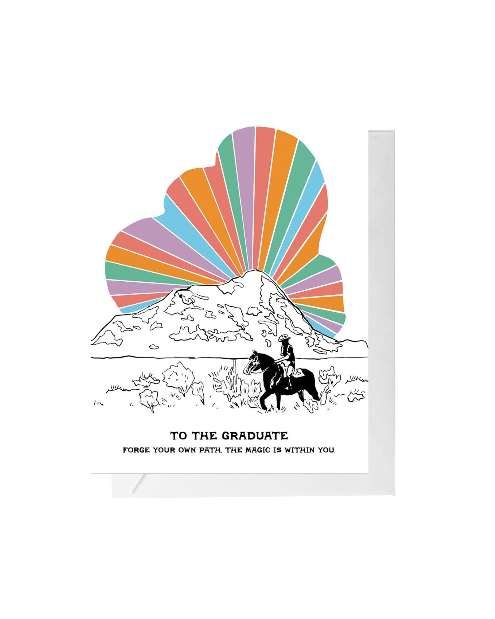 White greeting card with white envelope. Black and white desert scene with a cowboy in the foreground and bright rays coming out of a mountain. Bottom center text reads "to the graduate forge your own path the magic is within you" 