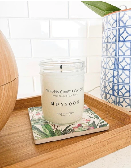 Monsoon candle sitting on a coaster
