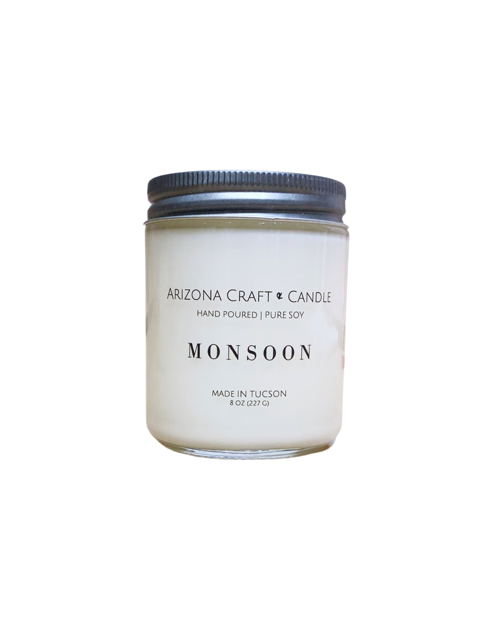 Clear glass Monsoon scented jar candle. 