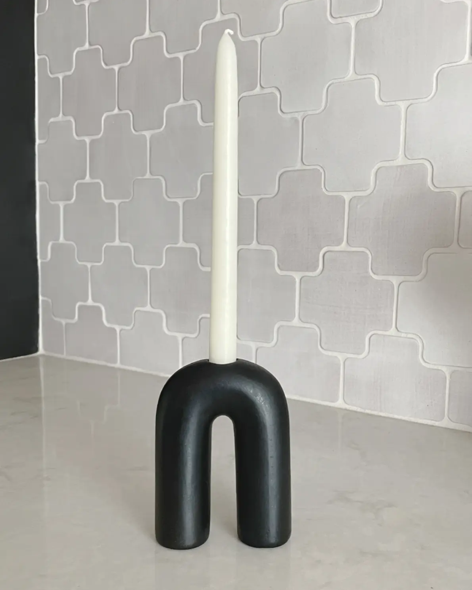 Arch candle holder and single white taper candle