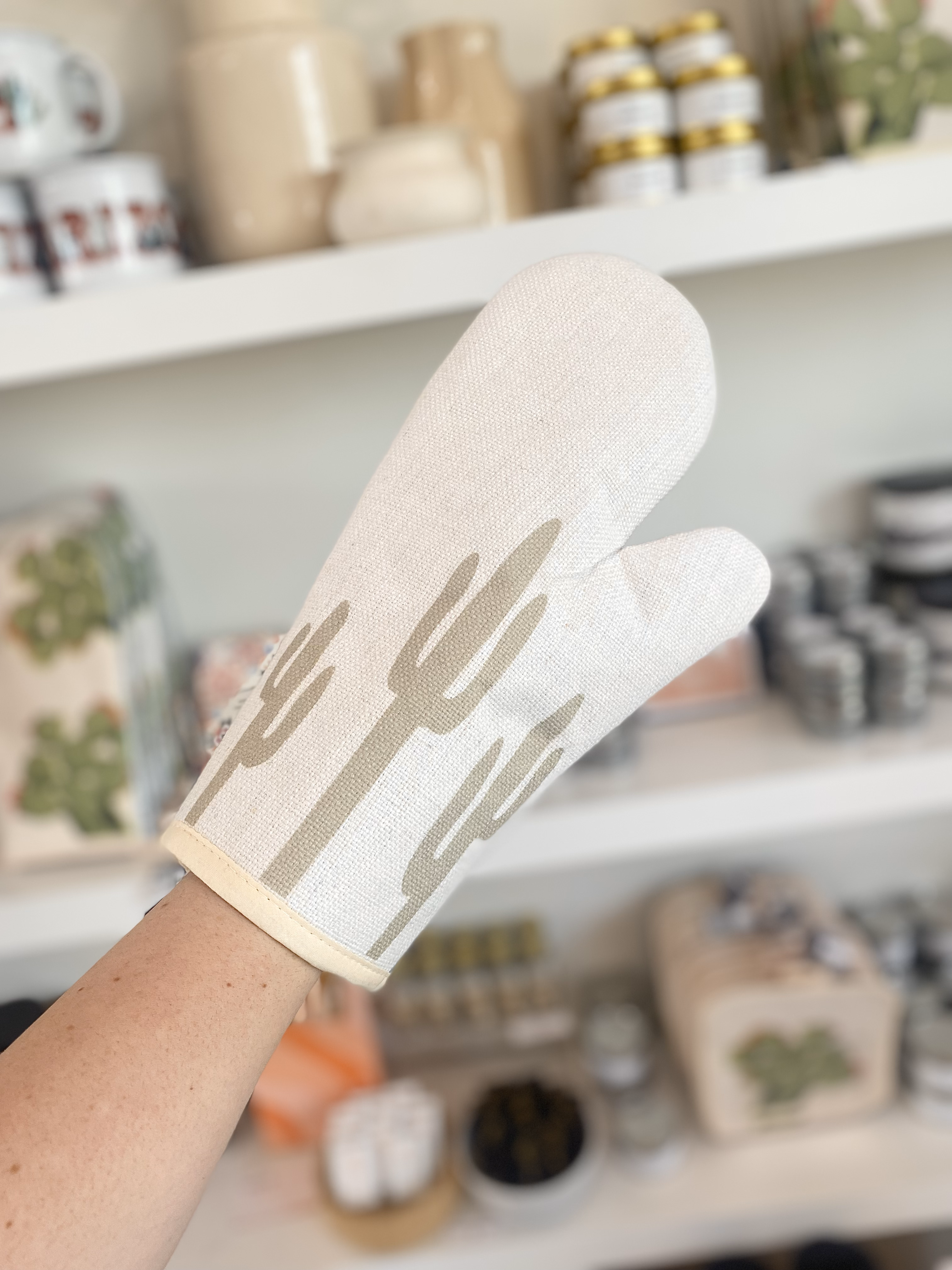 Person wearing left prickly pear oven mitt