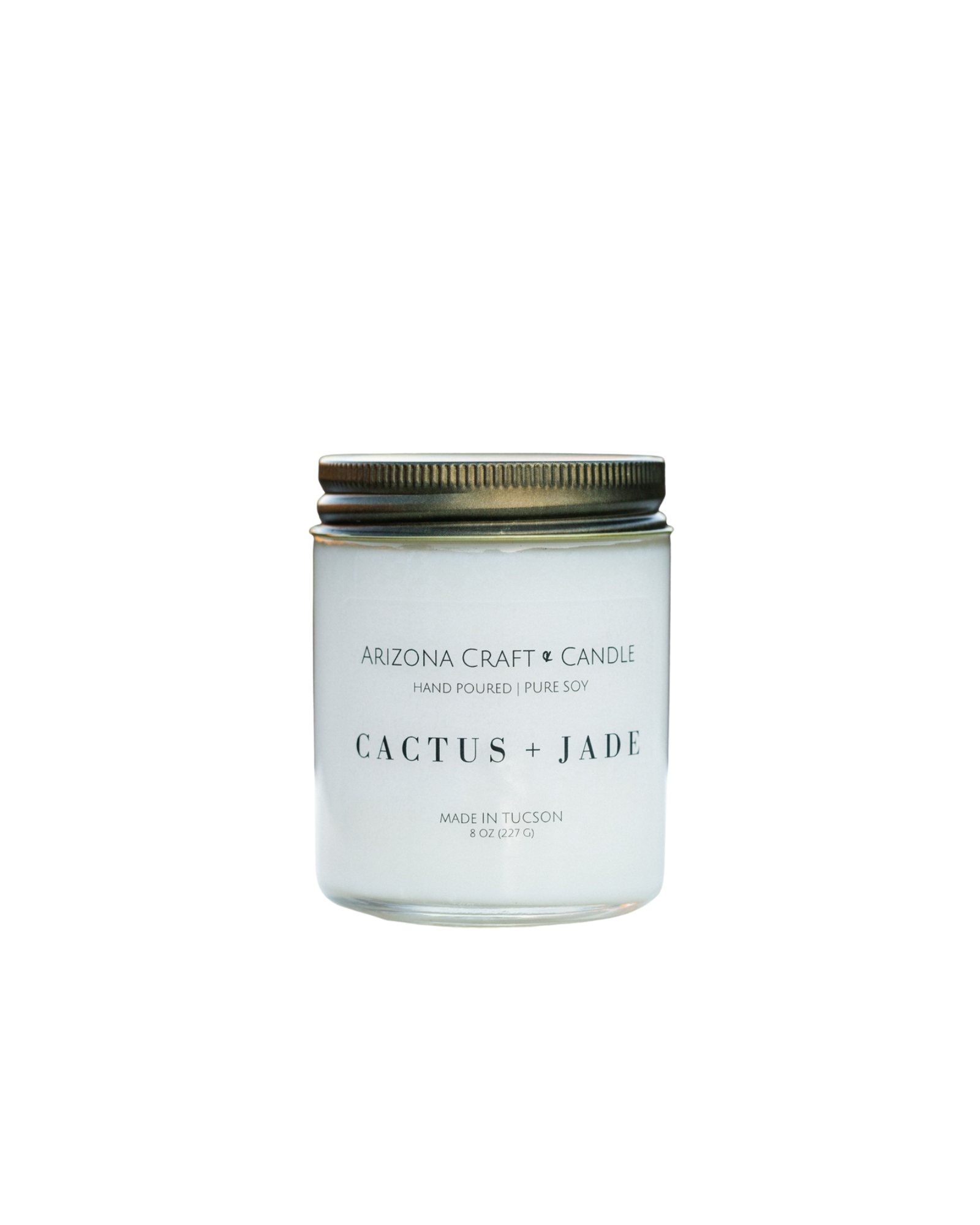 Clear glass jar candle with gold lid. Cactus and jade scent from Arizona Craft and Candle. 