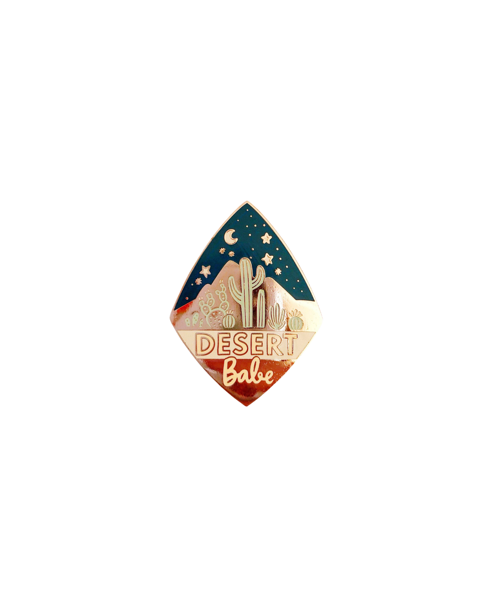 Diamond shaped enamel pin with a night desert scene and the words desert babe