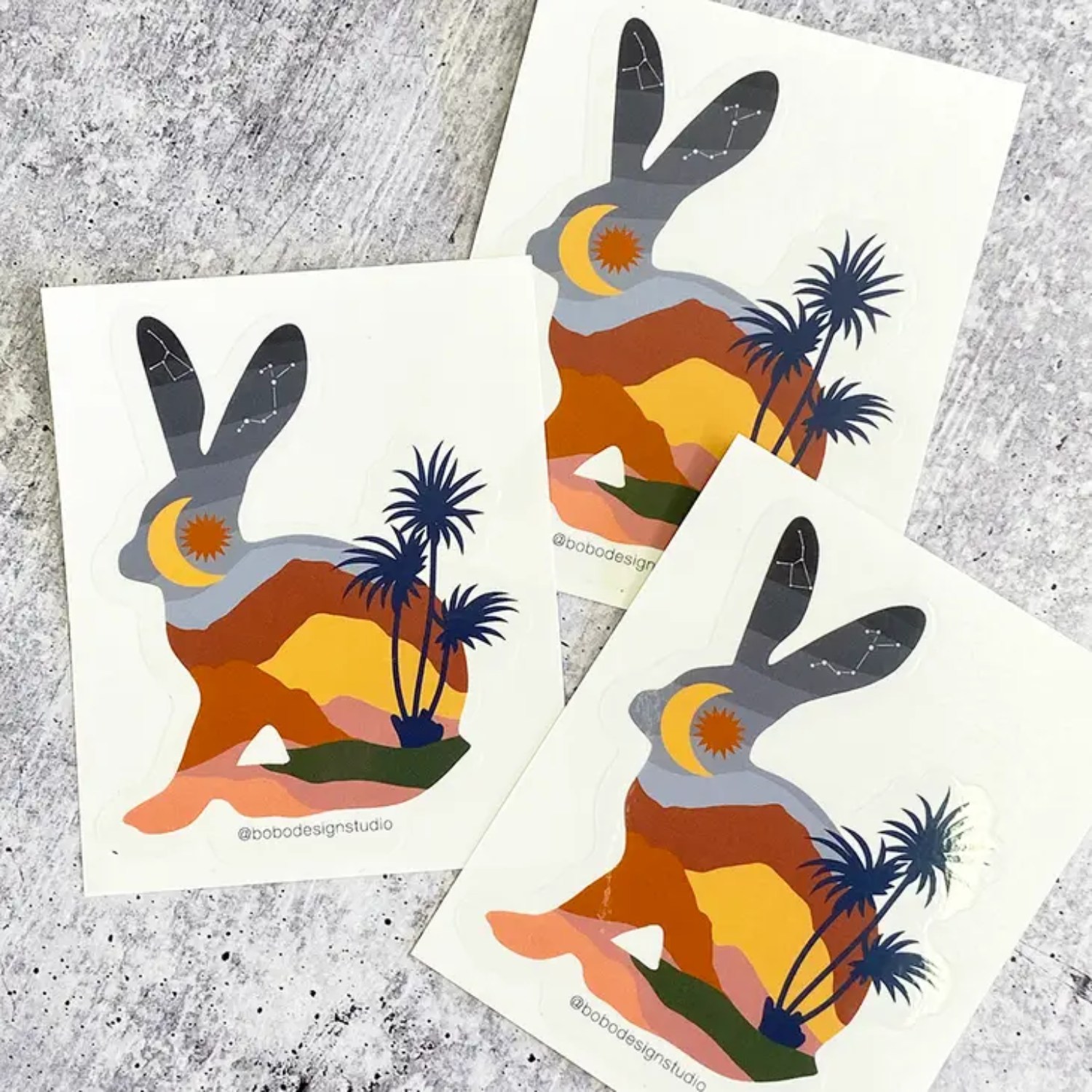 Three bunny stickers on white backing paper