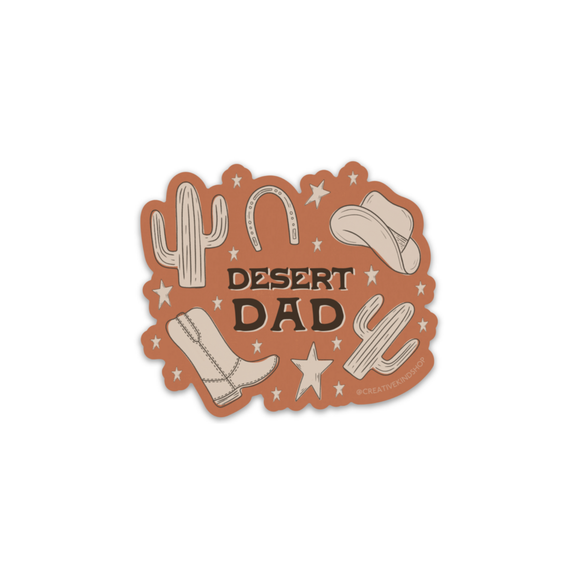 Die cut sticker with rusty orange background and the words "desert dad" surrounded by tan western doodles