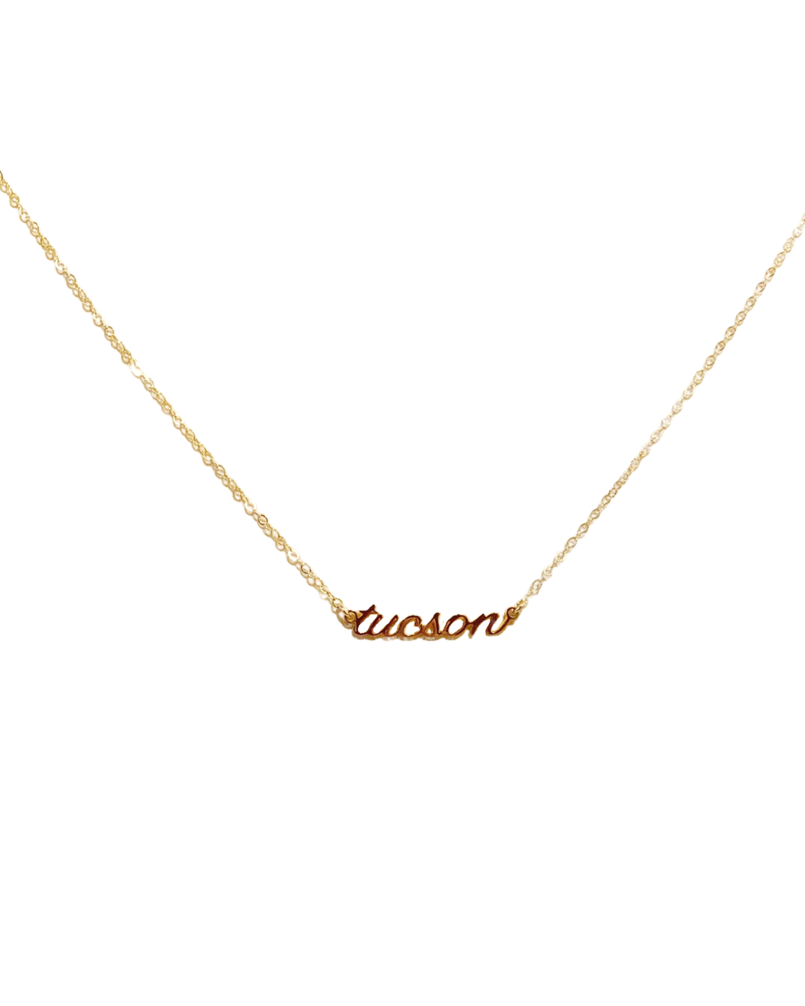 Gold necklace with the word Tucson in cursive font with a gold chain
