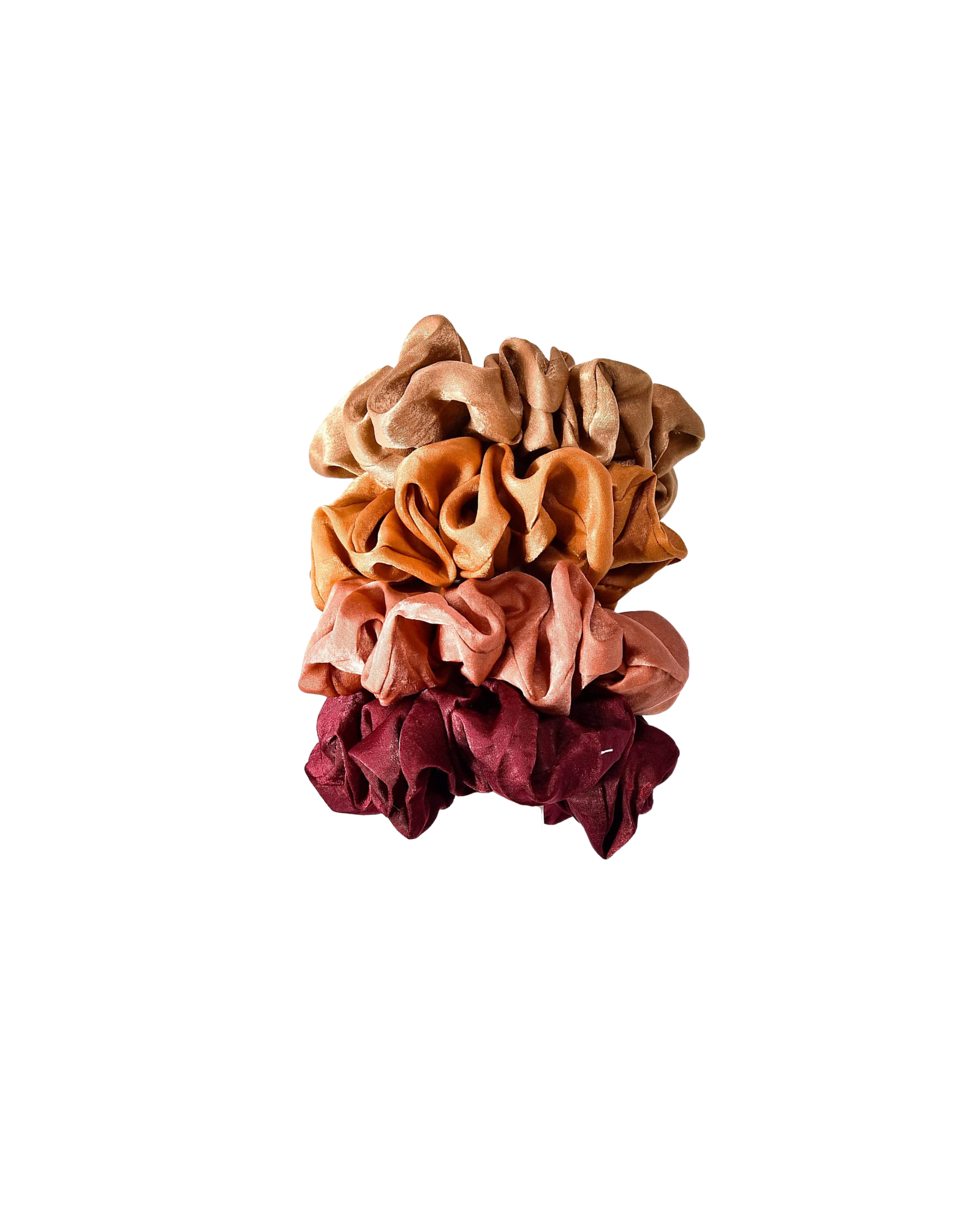Stack of four scrunchies in red, pink, orange, and tan